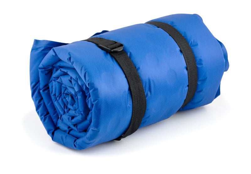 Rolled blue inflatable camping bed
