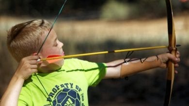 Boy shooting bow