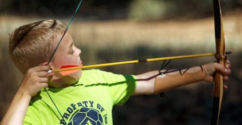 Boy shooting bow