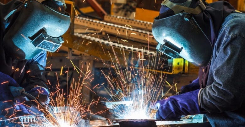 workers using welding gloves