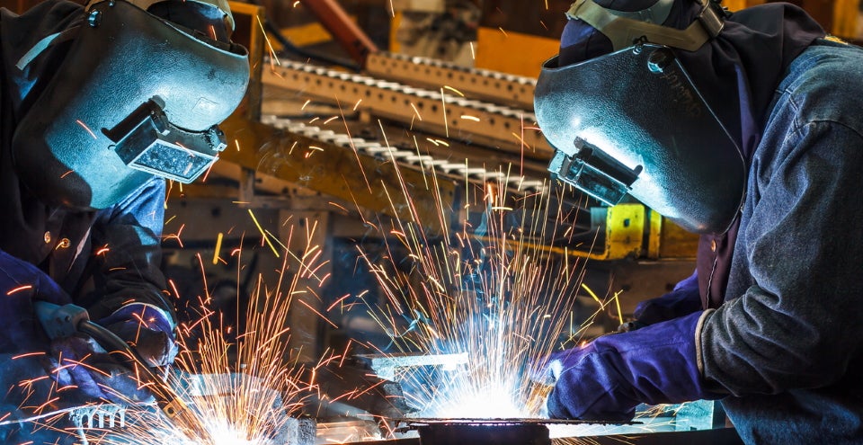 workers using welding gloves
