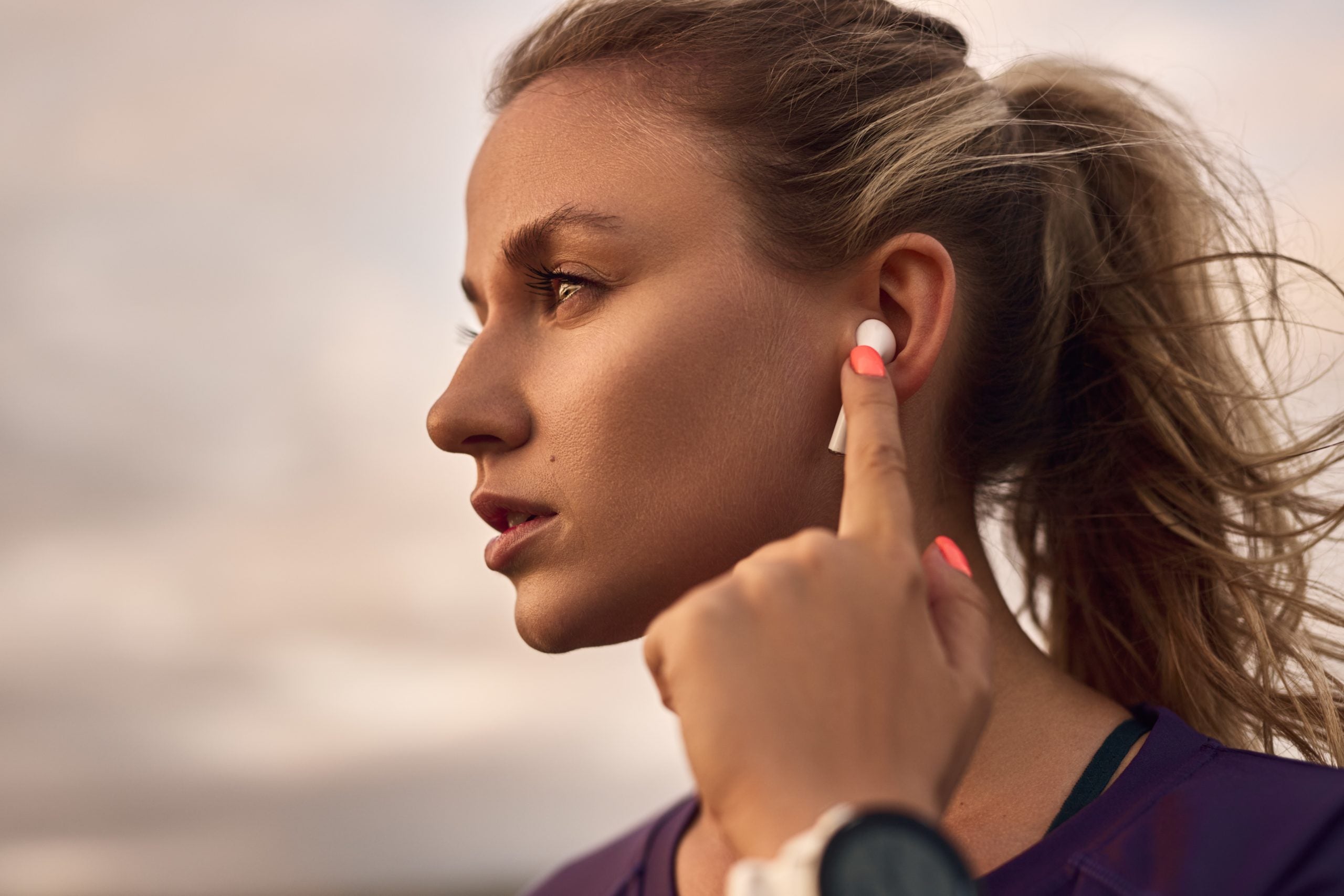 Leave the earbuds at home. Tuning in to the rhythm of the trail can enhance your running experience. Credit: Max Kegfire/Shutterstock